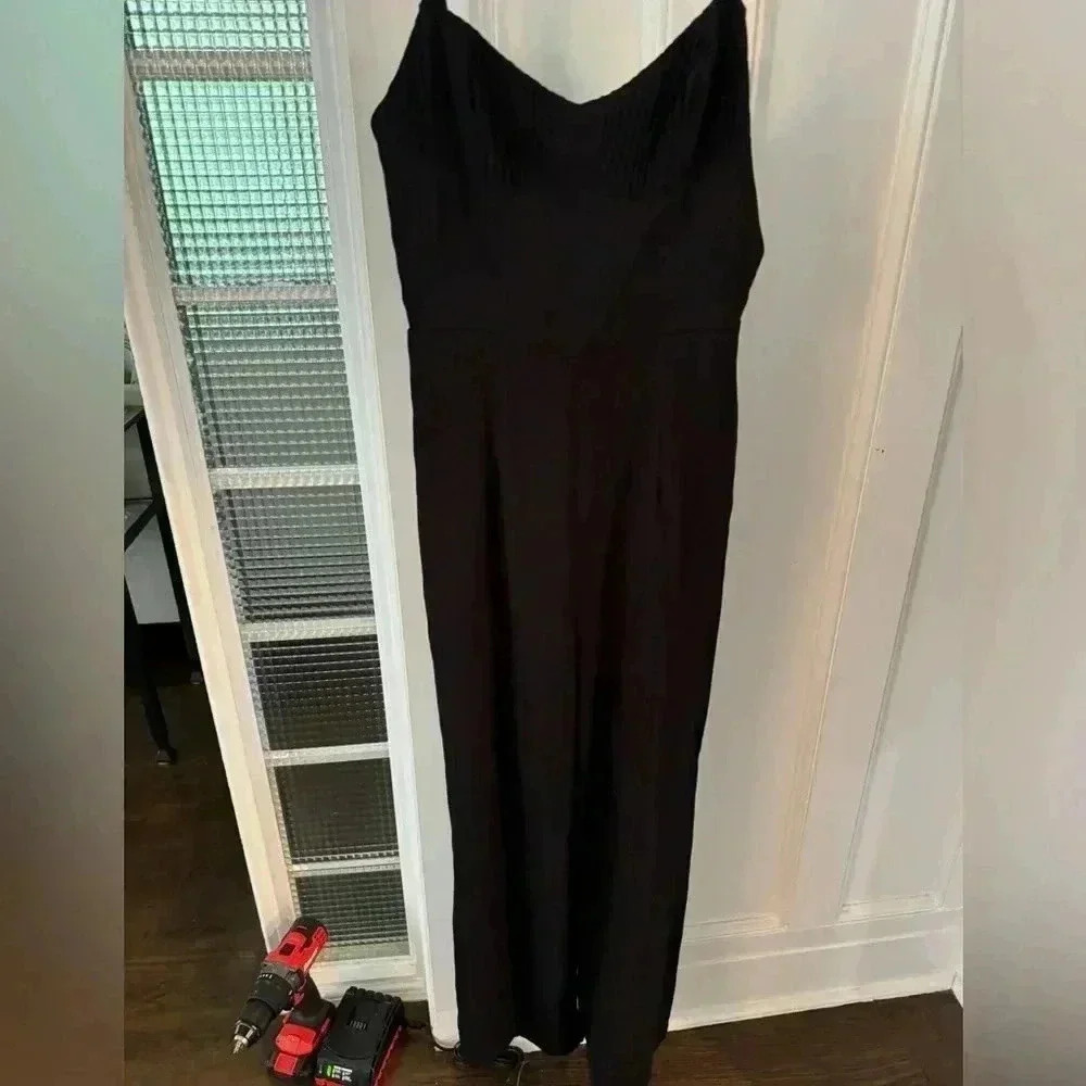 Princess Polly black spaghetti’s strap jumpsuit size 4 NWOT